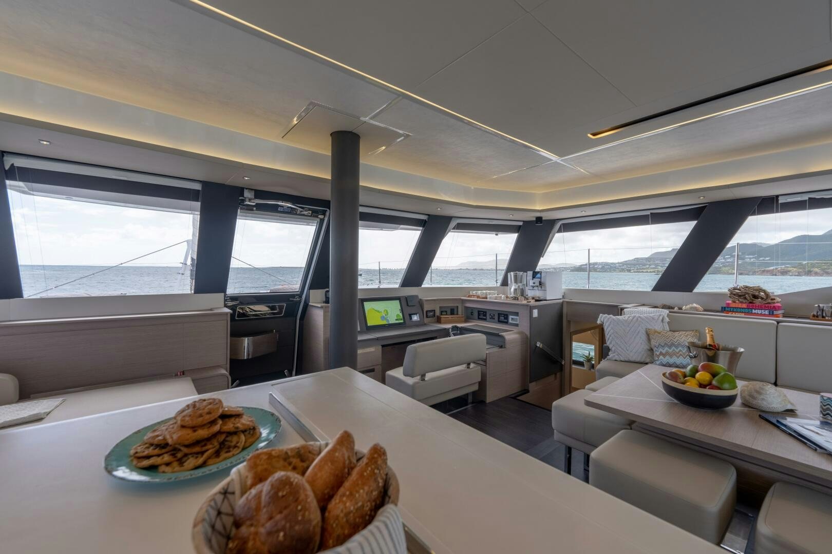 a room with a table and chairs aboard OCEANUS Yacht for Sale