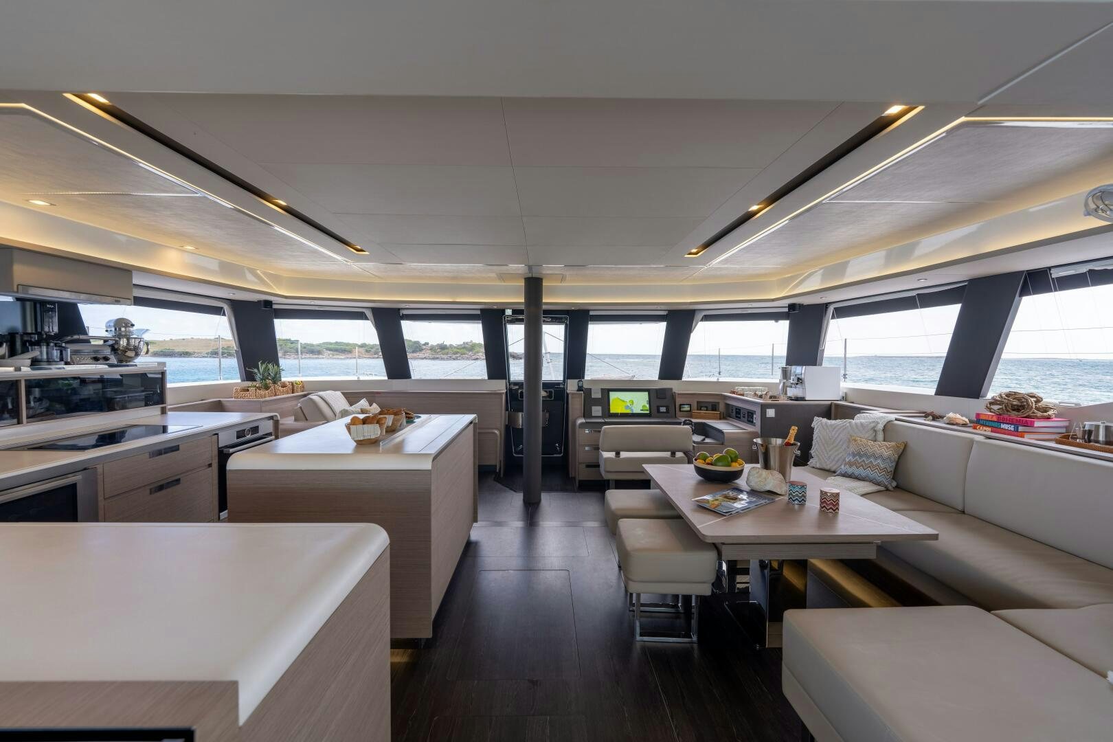 a room with a table and chairs aboard OCEANUS Yacht for Sale