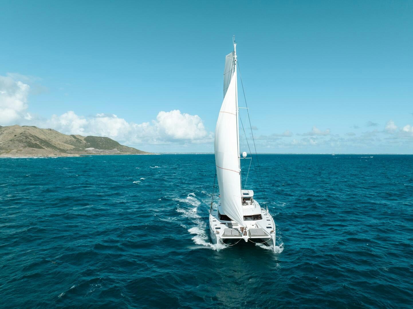 a sailboat on the water aboard OCEANUS Yacht for Sale
