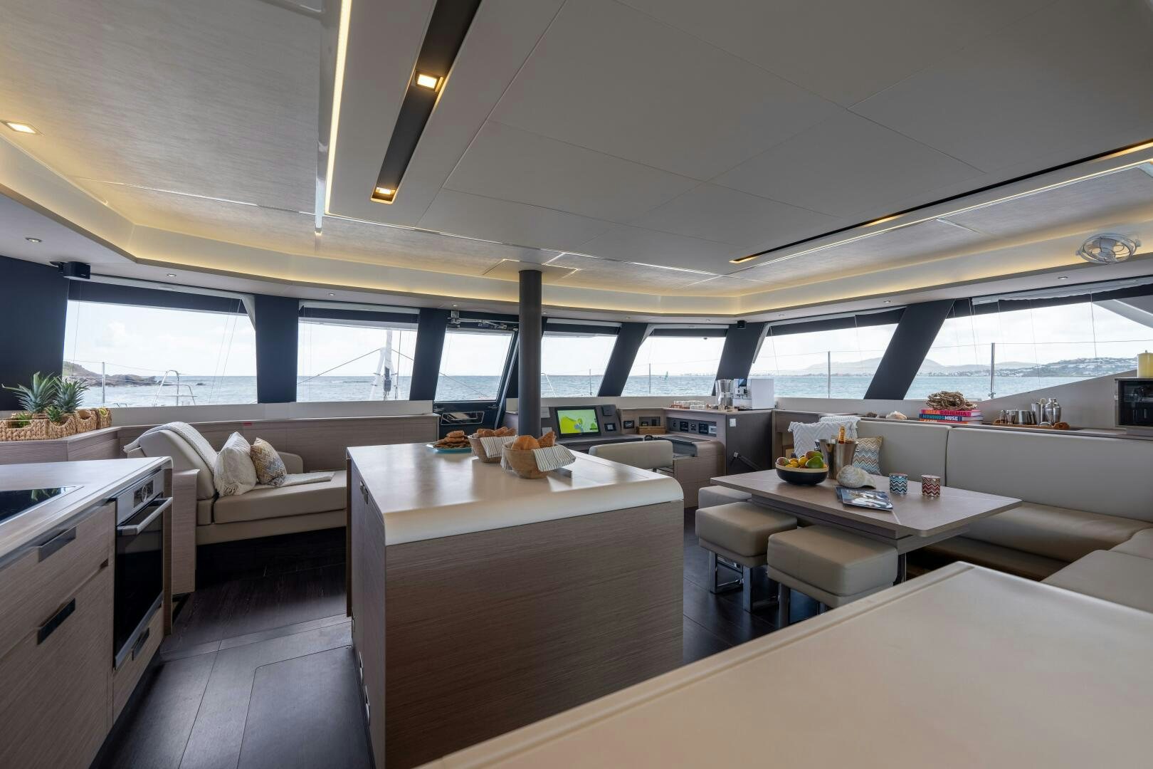 a room with a bed and a table aboard OCEANUS Yacht for Sale