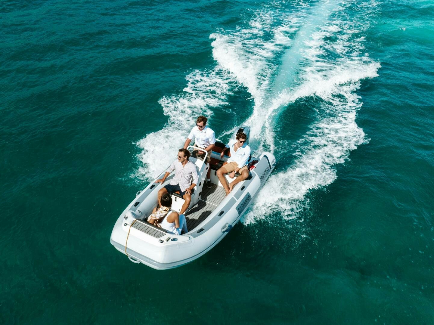 a group of people on a boat aboard OCEANUS Yacht for Sale