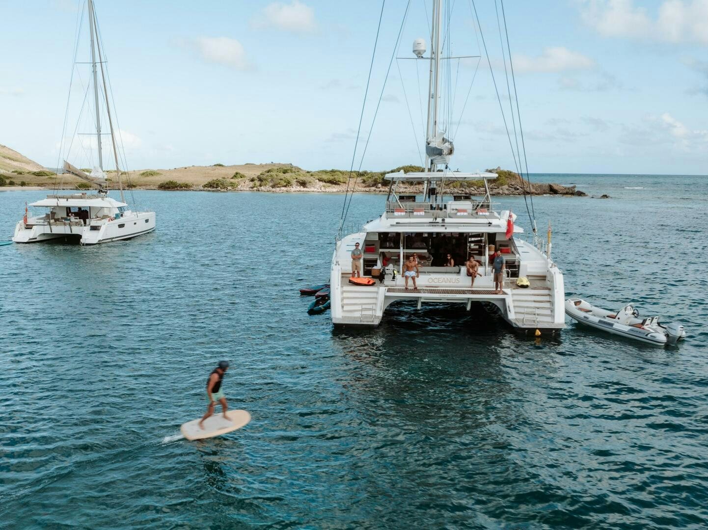 a person surfing on the sea aboard OCEANUS Yacht for Sale