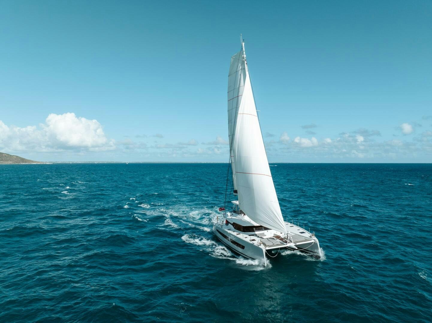 a sailboat on the water aboard OCEANUS Yacht for Sale