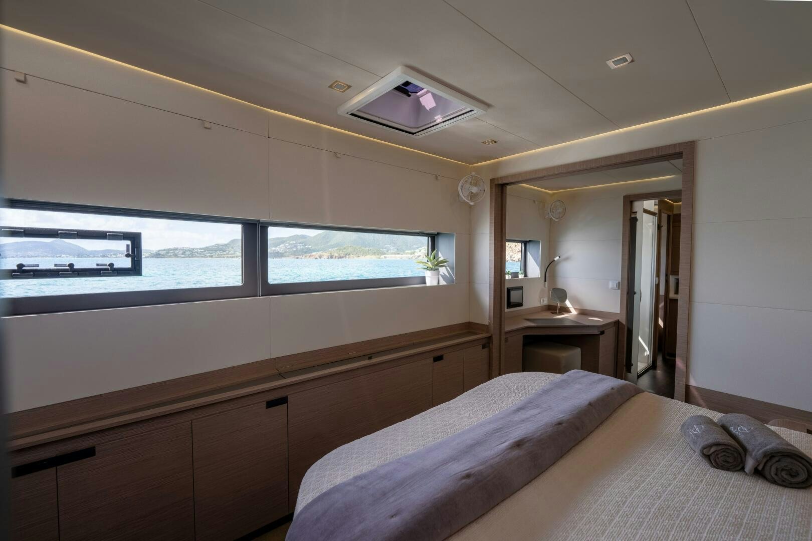 a room with two beds aboard OCEANUS Yacht for Sale