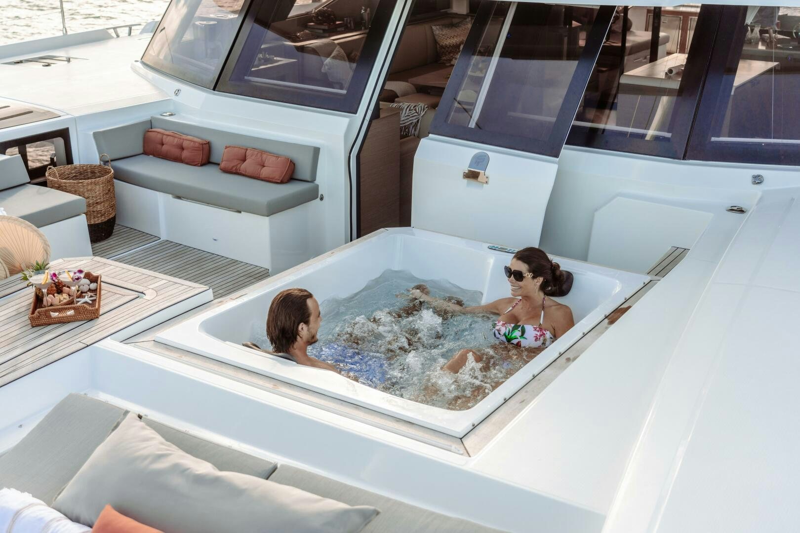 a couple of people in a room aboard OCEANUS Yacht for Sale