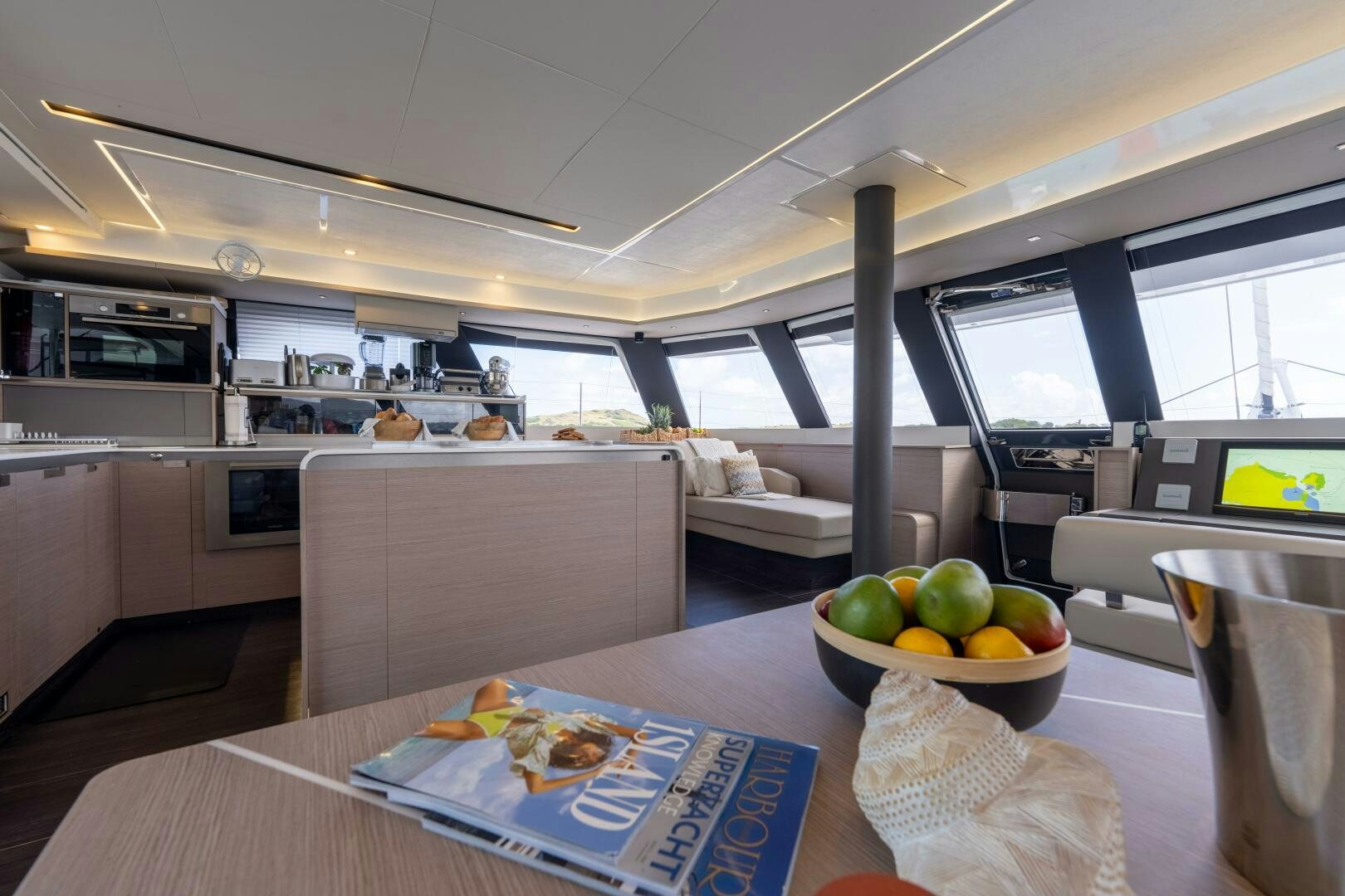 a kitchen with a bowl of fruit aboard OCEANUS Yacht for Sale