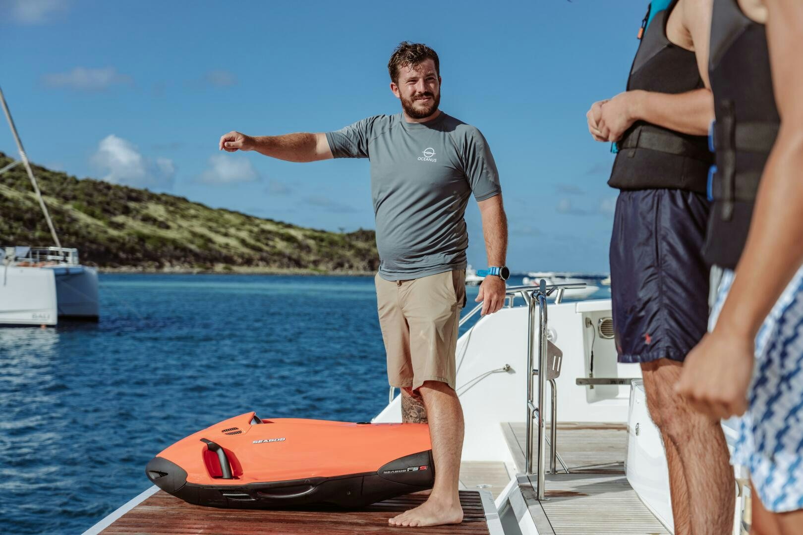 a person standing on a boat aboard OCEANUS Yacht for Sale