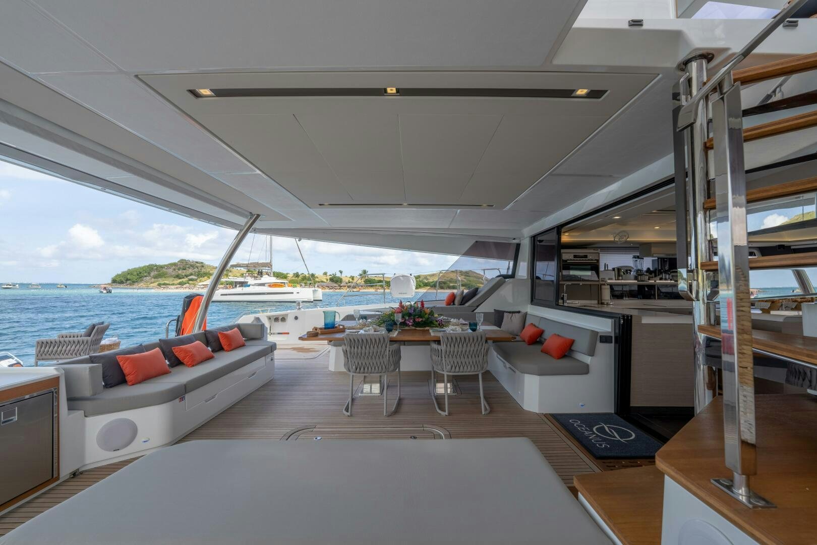a living room with a large window aboard OCEANUS Yacht for Sale
