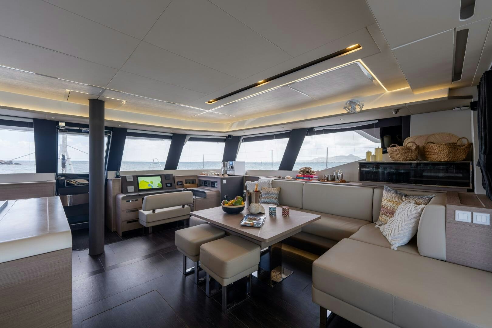 a room with a couch and a table aboard OCEANUS Yacht for Sale