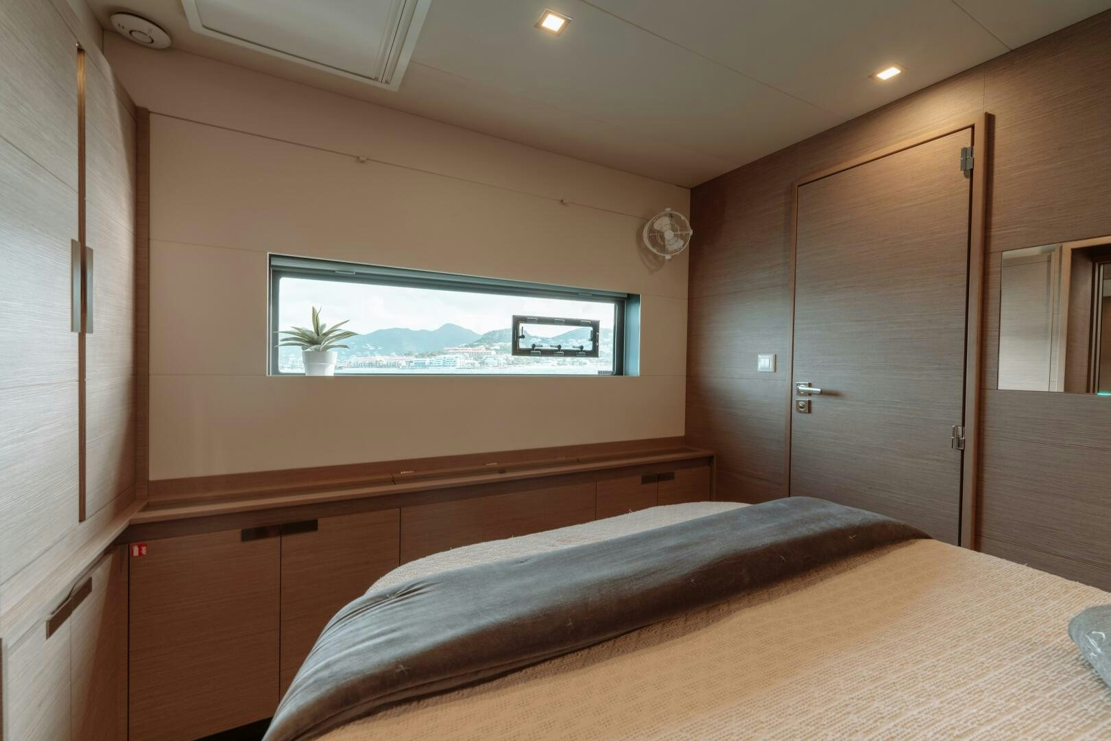 a bed in a room aboard OCEANUS Yacht for Sale