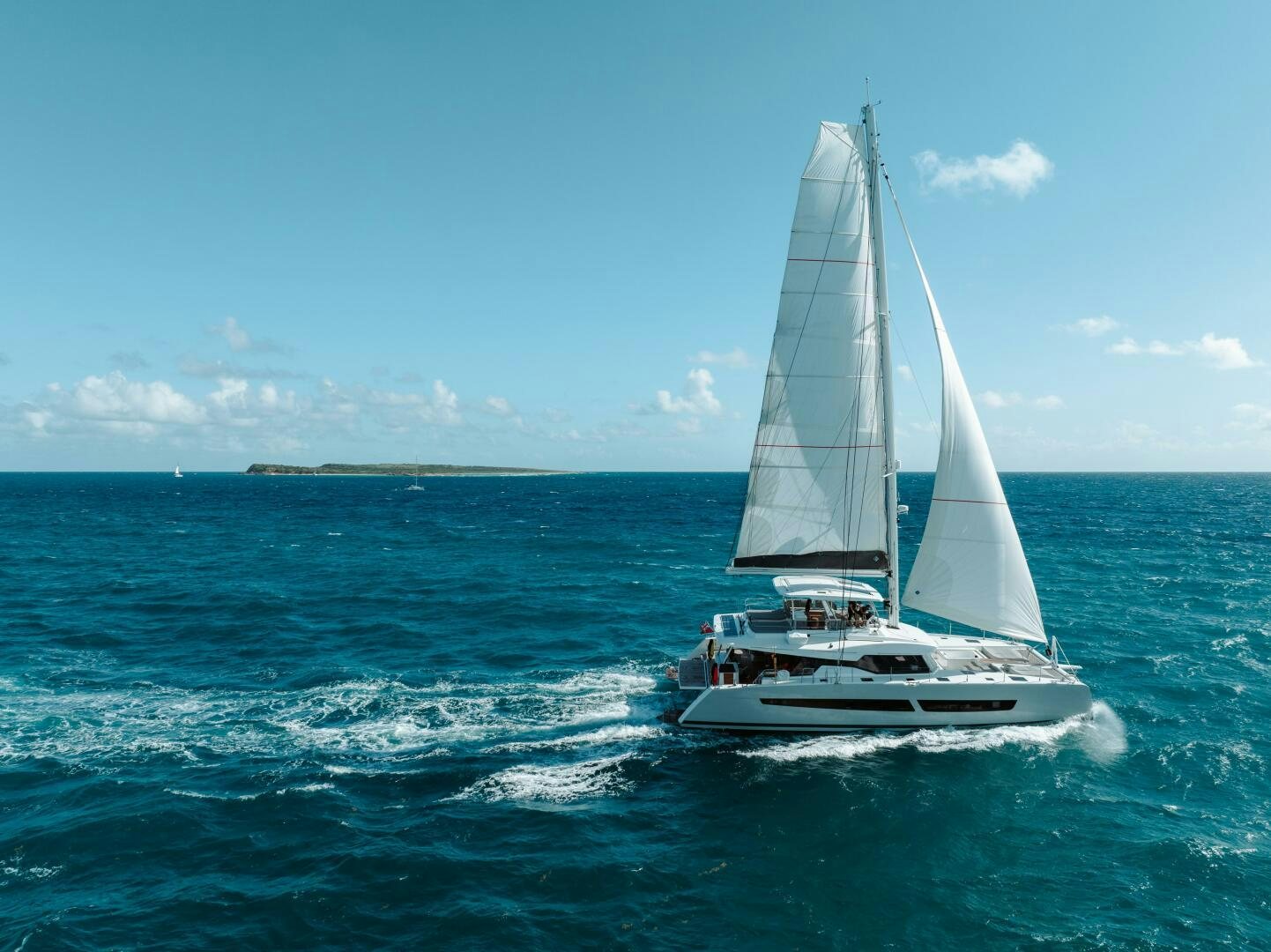 a sailboat on the water aboard OCEANUS Yacht for Sale