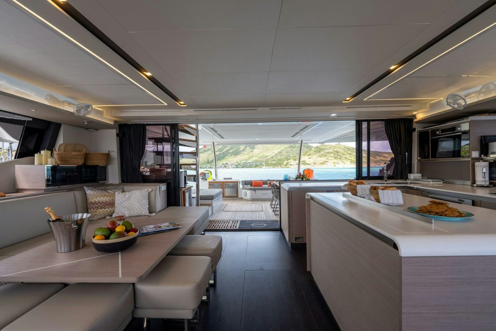 a kitchen with a large window aboard OCEANUS Yacht for Sale