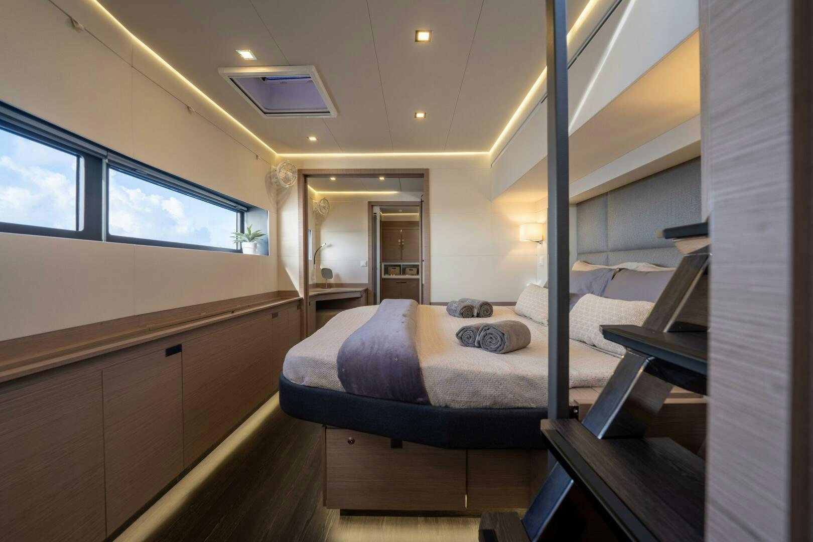 a room with a bed and a window aboard OCEANUS Yacht for Sale