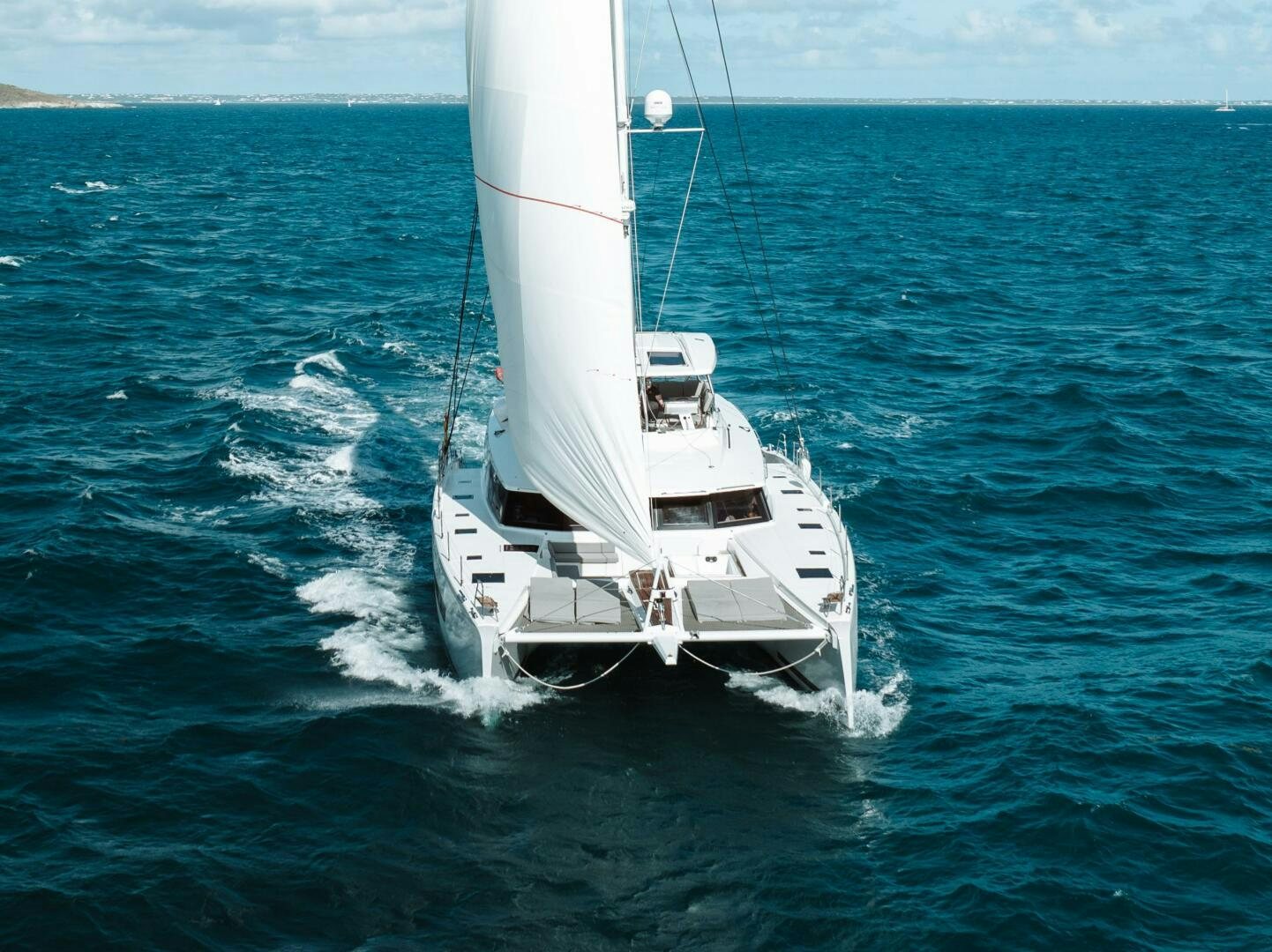 a white boat in the water aboard OCEANUS Yacht for Sale