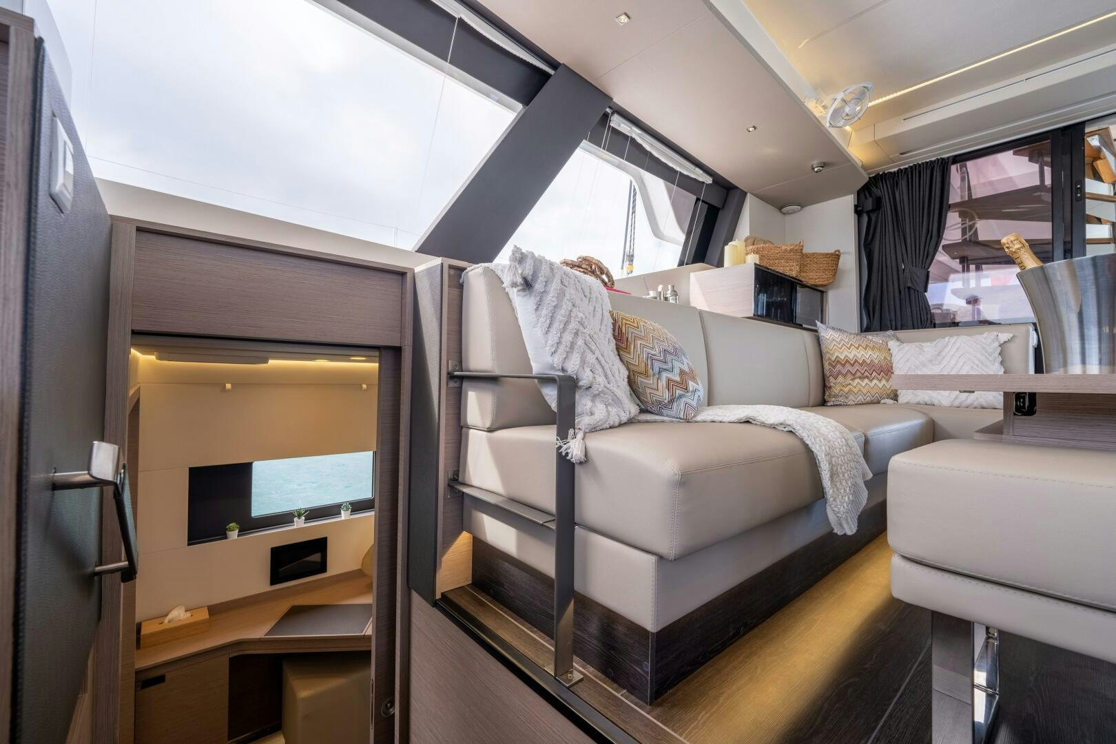 a room with a couch and a television aboard OCEANUS Yacht for Sale