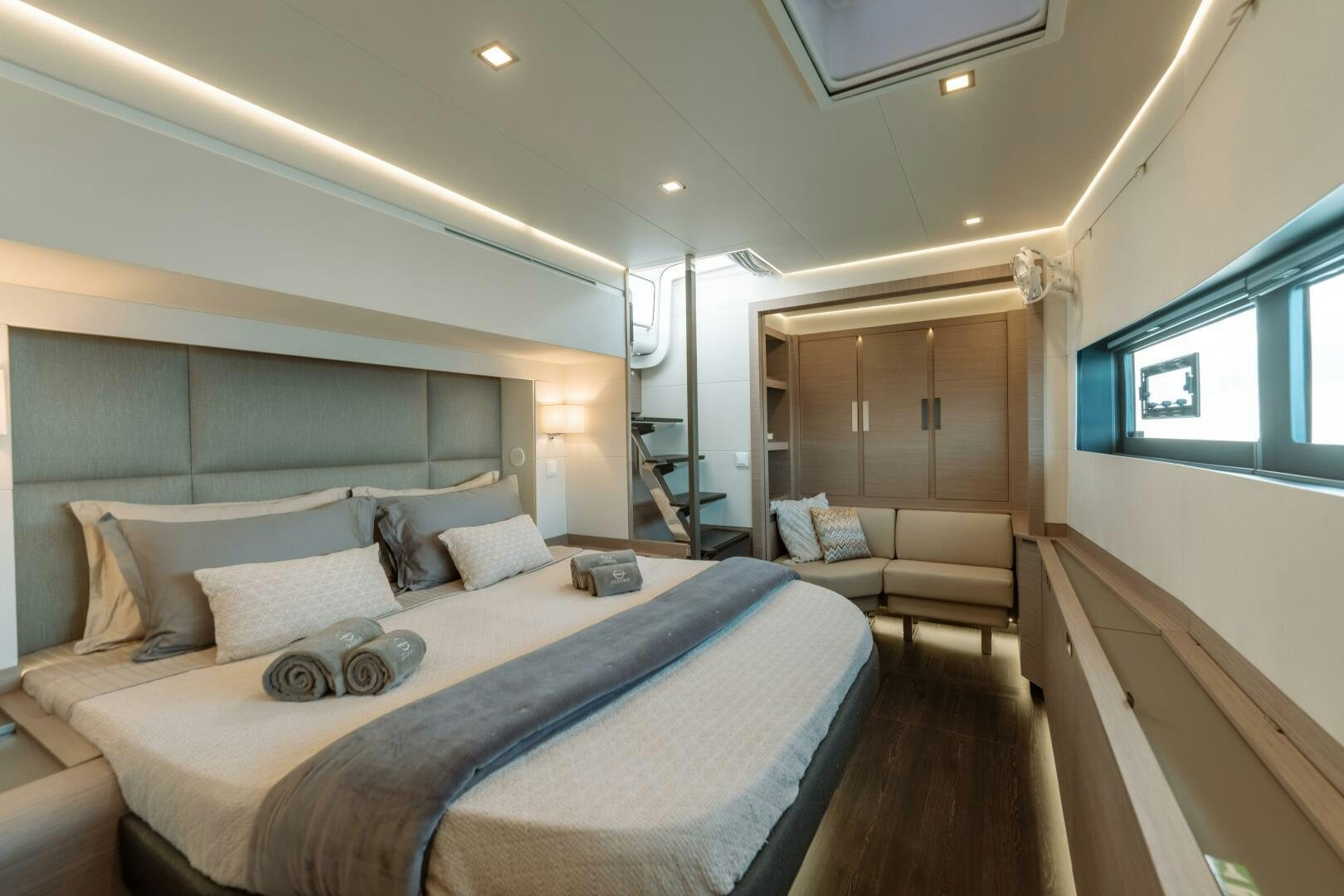 a large bed in a room aboard OCEANUS Yacht for Sale