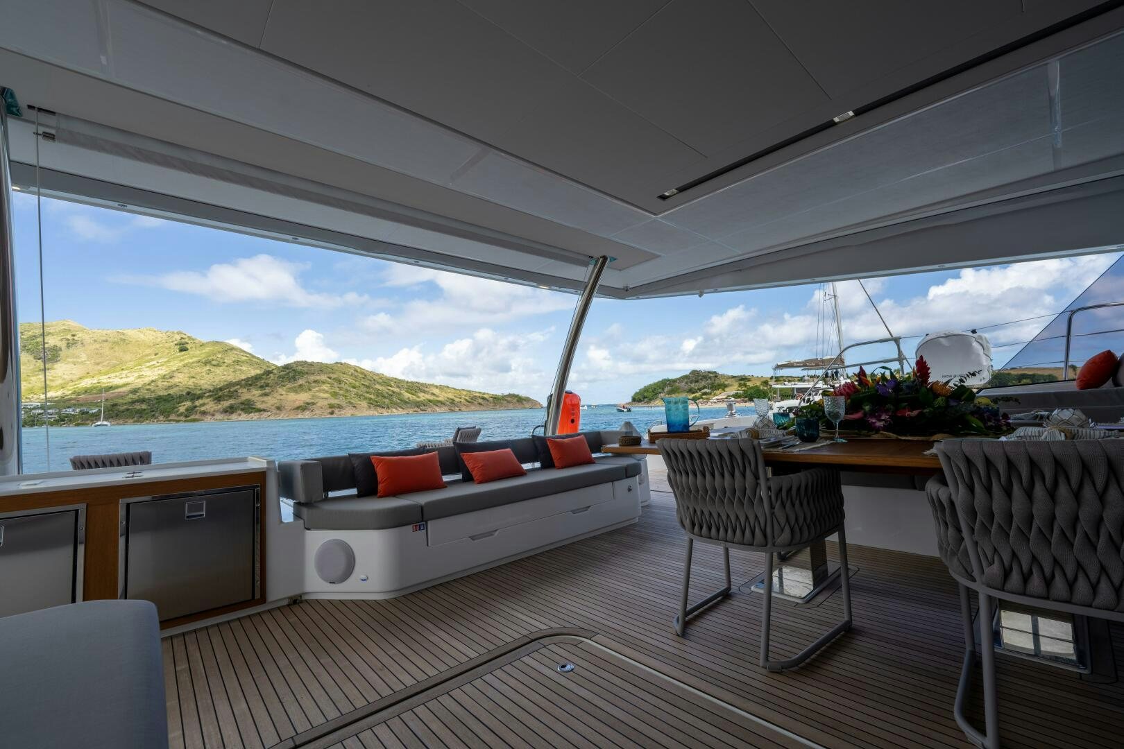 a large room with a couch and a table and chairs aboard OCEANUS Yacht for Sale