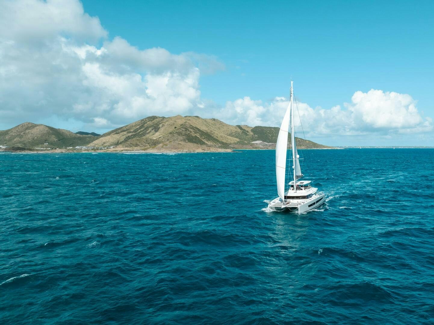 a sailboat on the water aboard OCEANUS Yacht for Sale