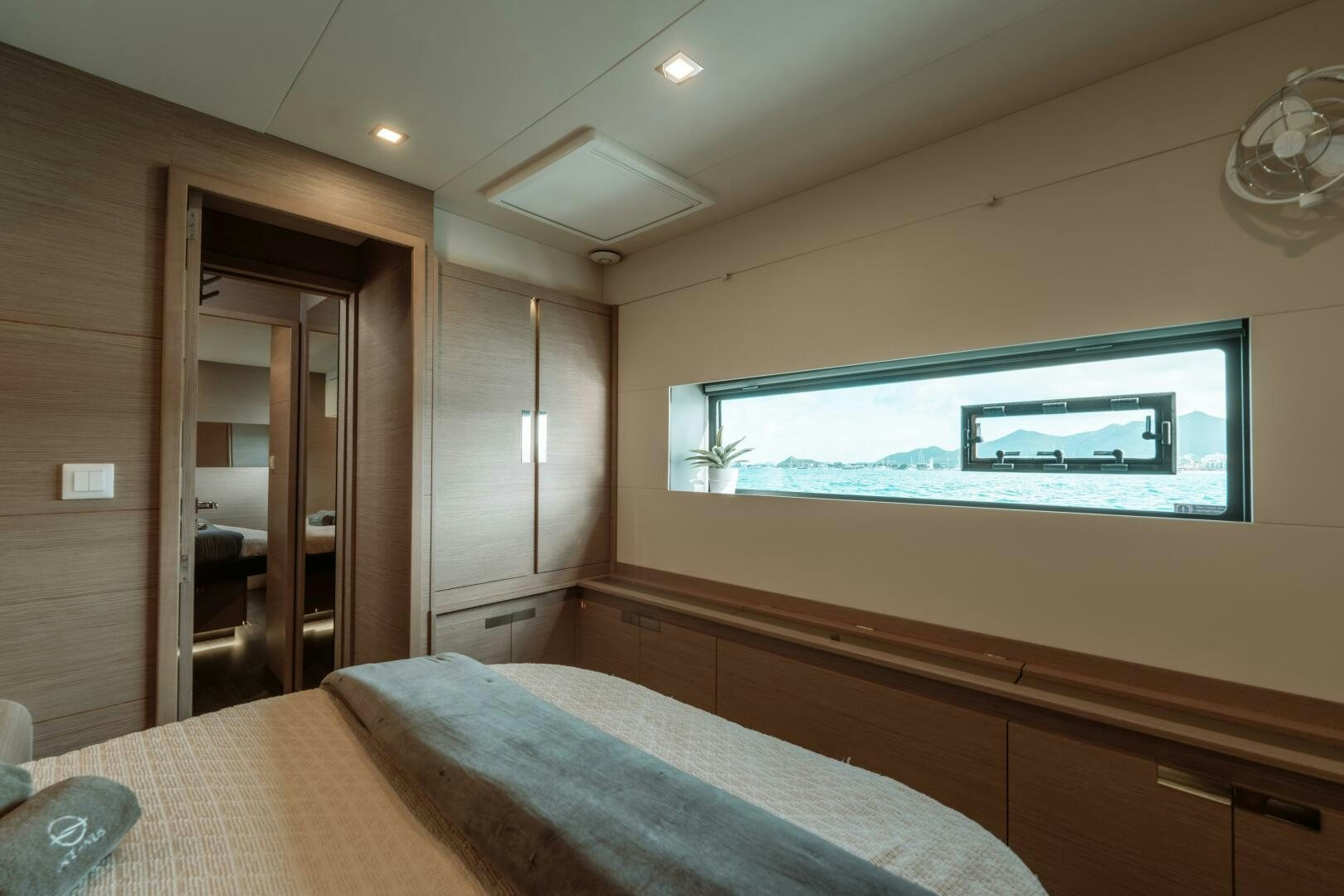 a bedroom with a large television aboard OCEANUS Yacht for Sale