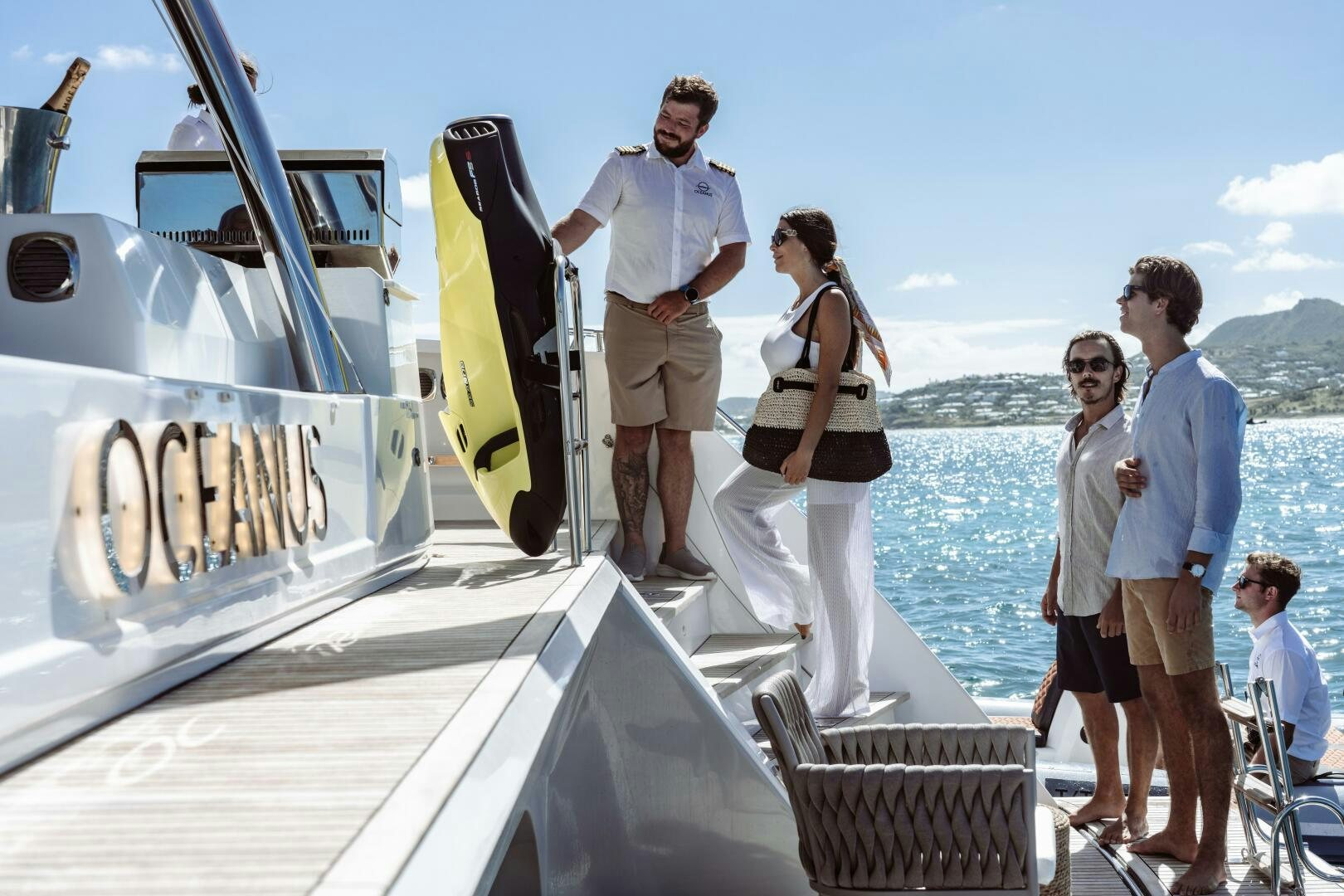 a group of people on a boat aboard OCEANUS Yacht for Sale