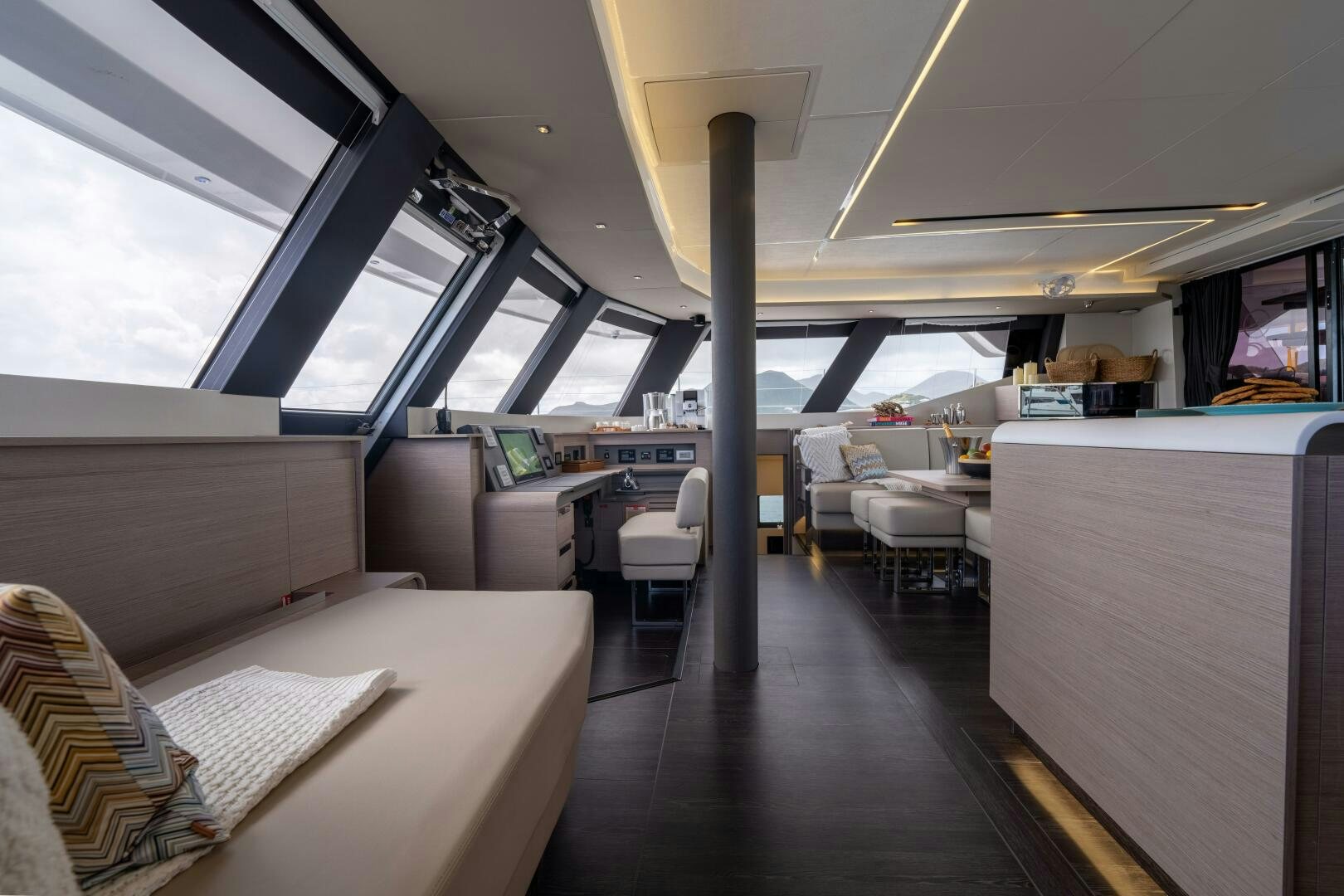 a room with a couch and a table aboard OCEANUS Yacht for Sale