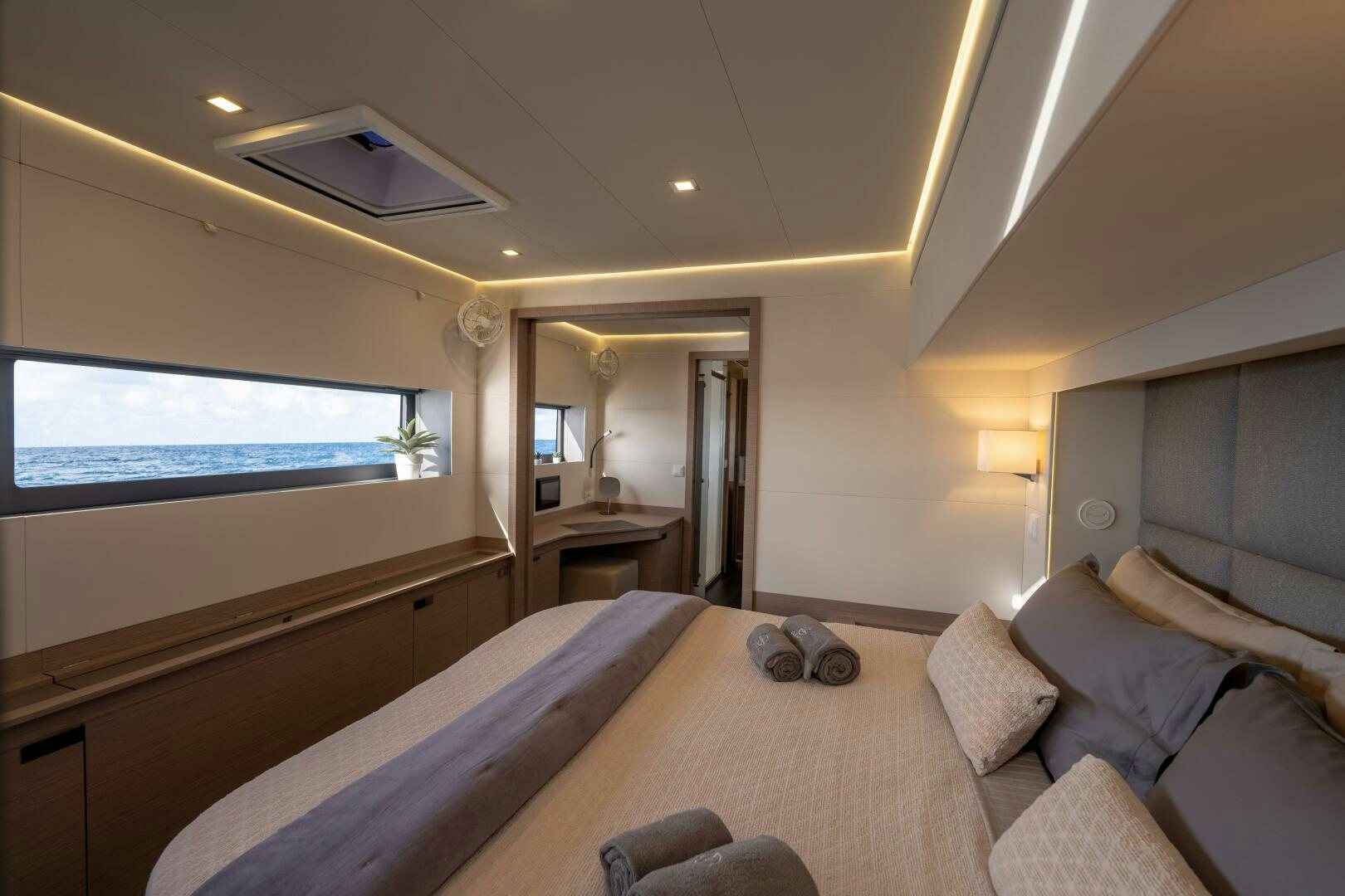 a bedroom with a bed and a television aboard OCEANUS Yacht for Sale