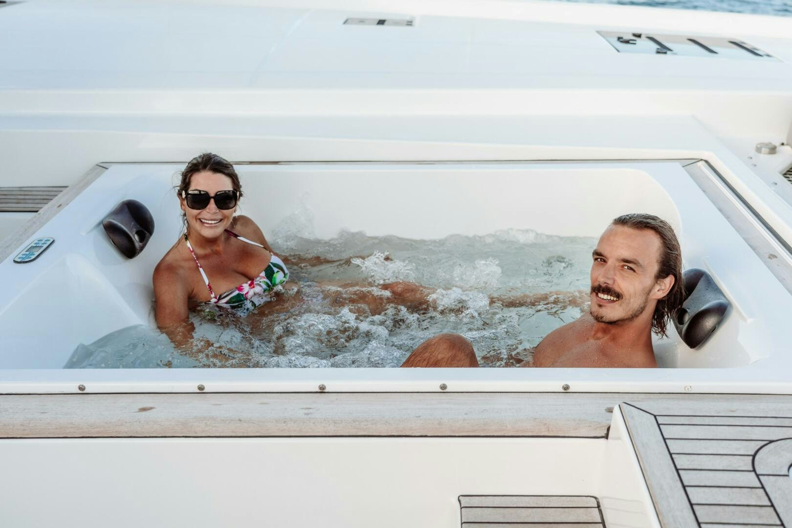 a group of women in a swimming pool aboard OCEANUS Yacht for Sale