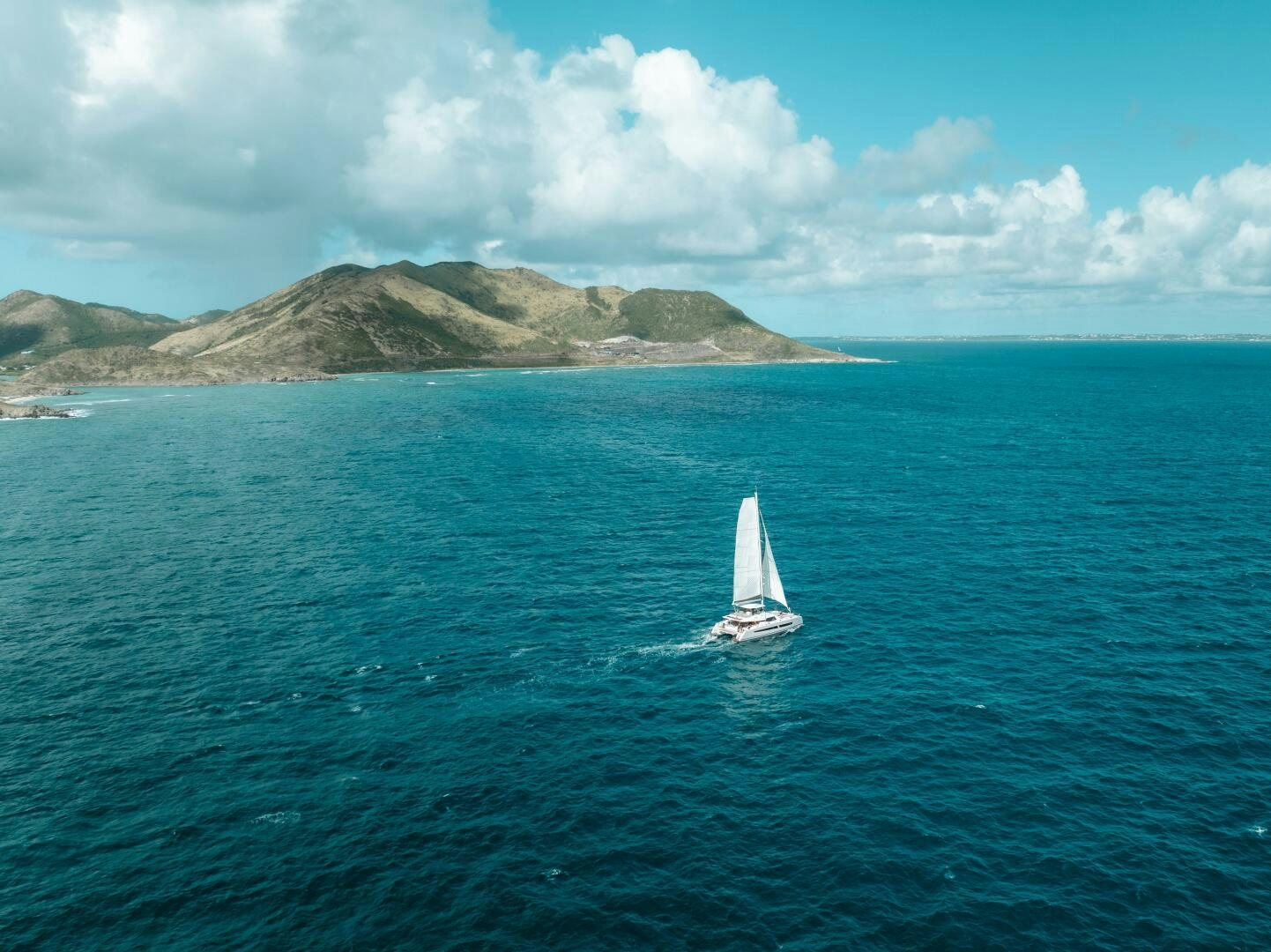 a sailboat on the water aboard OCEANUS Yacht for Sale