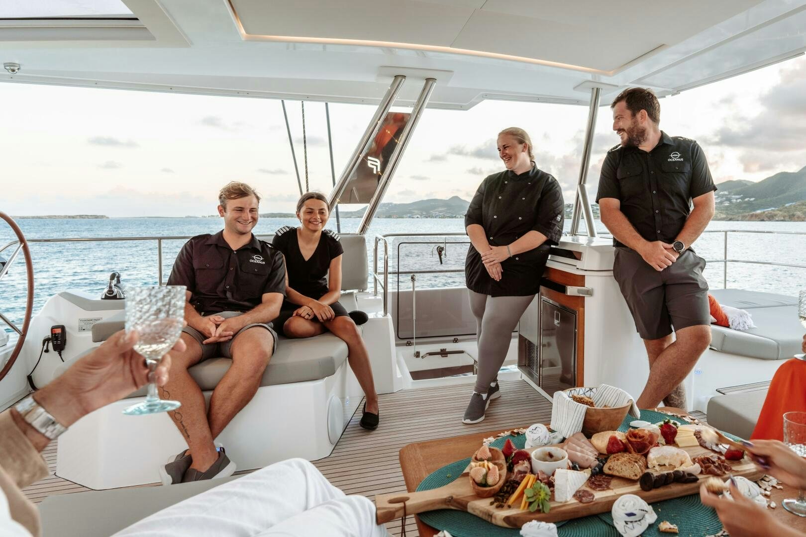 a group of people on a boat aboard OCEANUS Yacht for Sale