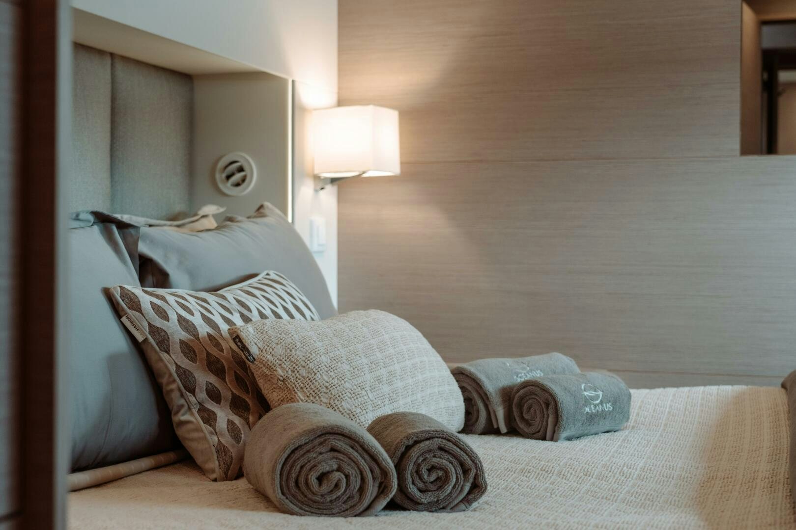 a bed with pillows aboard OCEANUS Yacht for Sale
