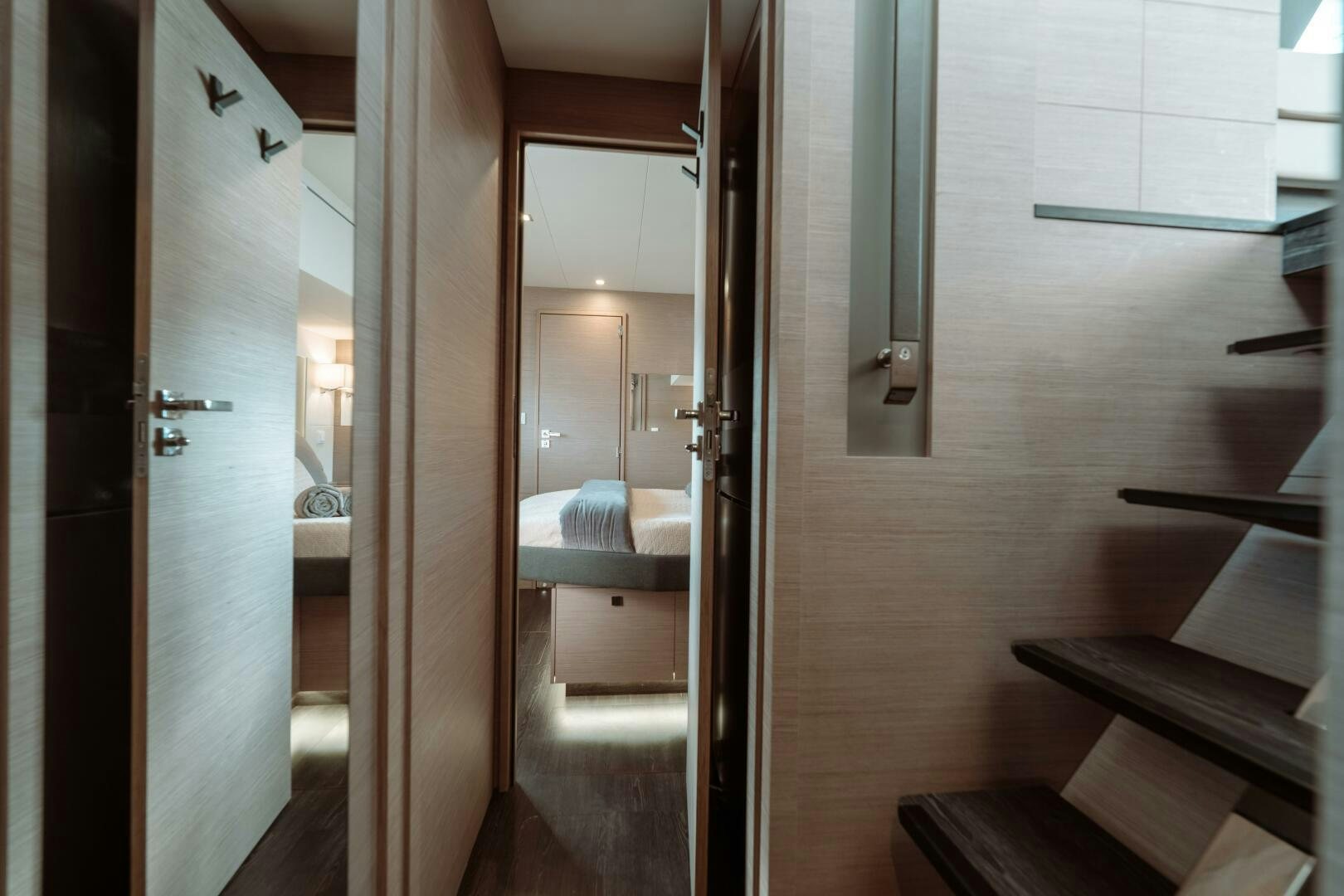 a room with a bed and a mirror aboard OCEANUS Yacht for Sale