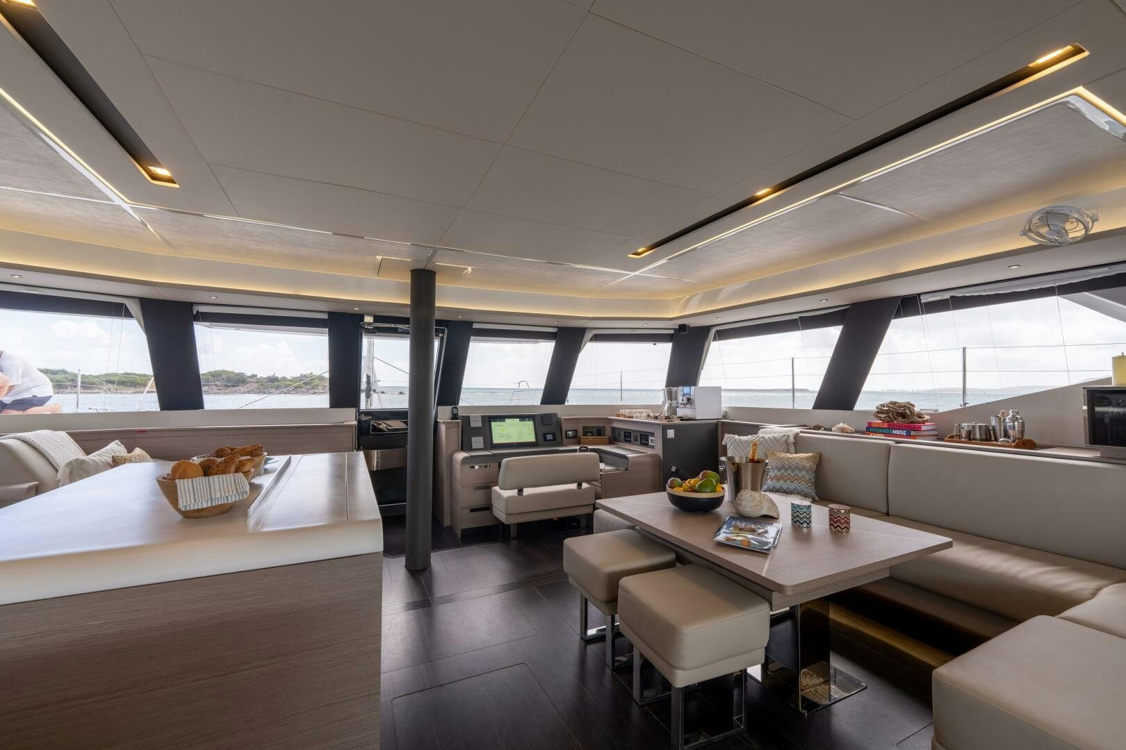 a room with a table and chairs aboard OCEANUS Yacht for Sale