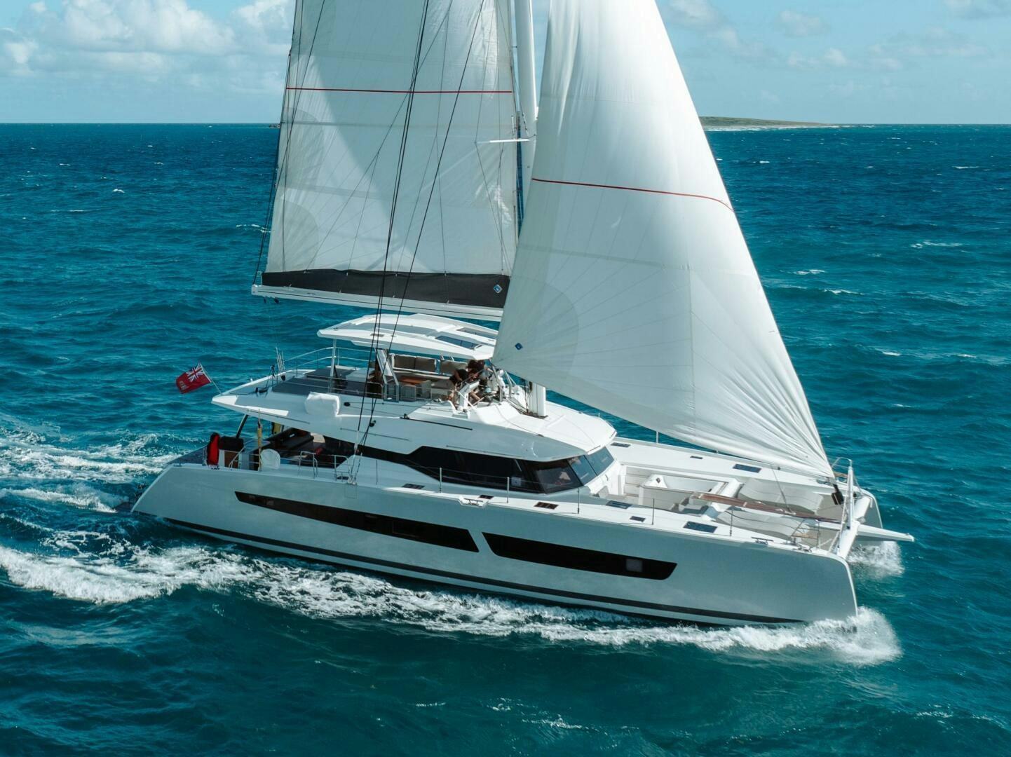 a white boat on the water aboard OCEANUS Yacht for Sale