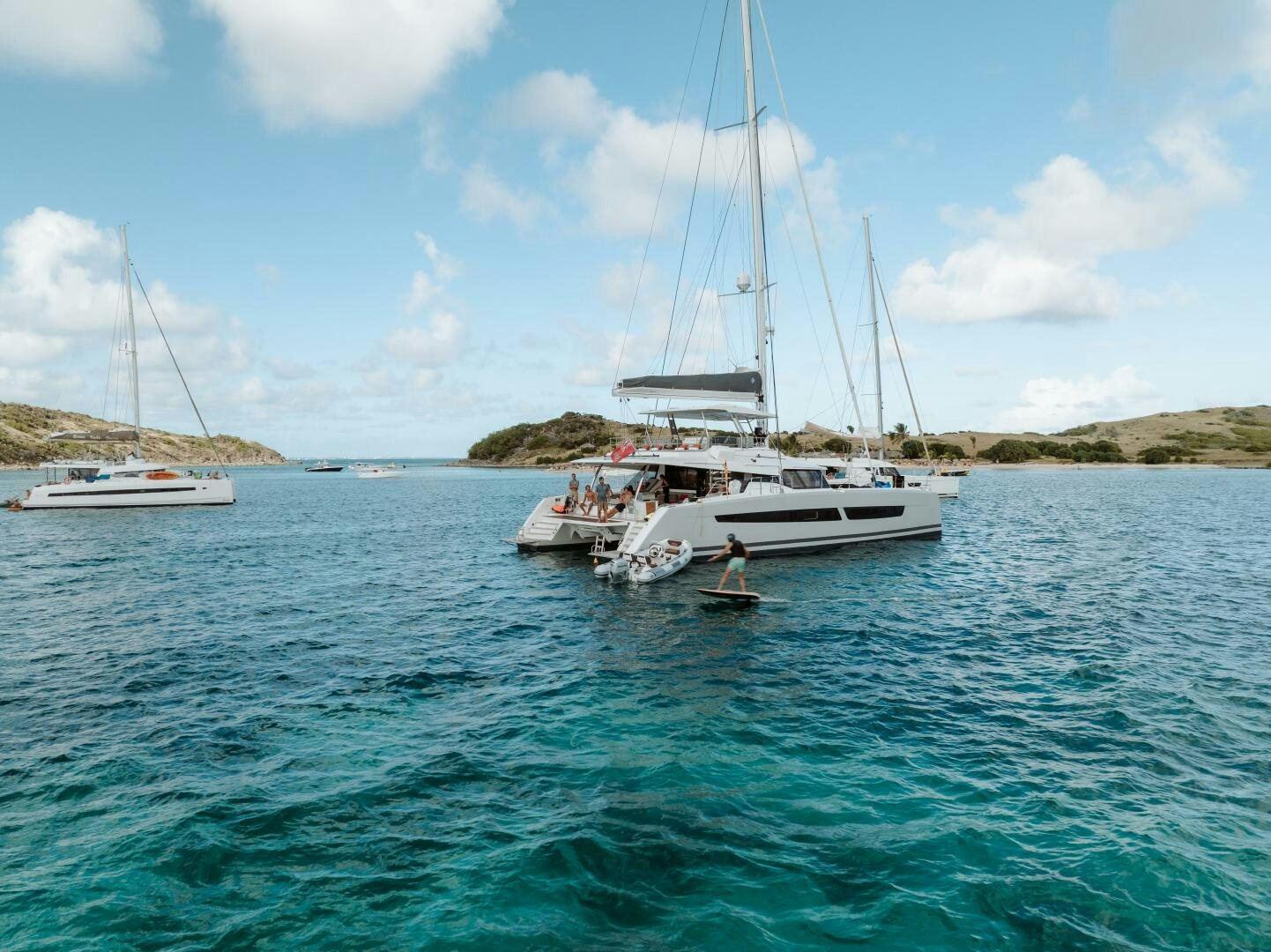 a couple of boats on the water aboard OCEANUS Yacht for Sale
