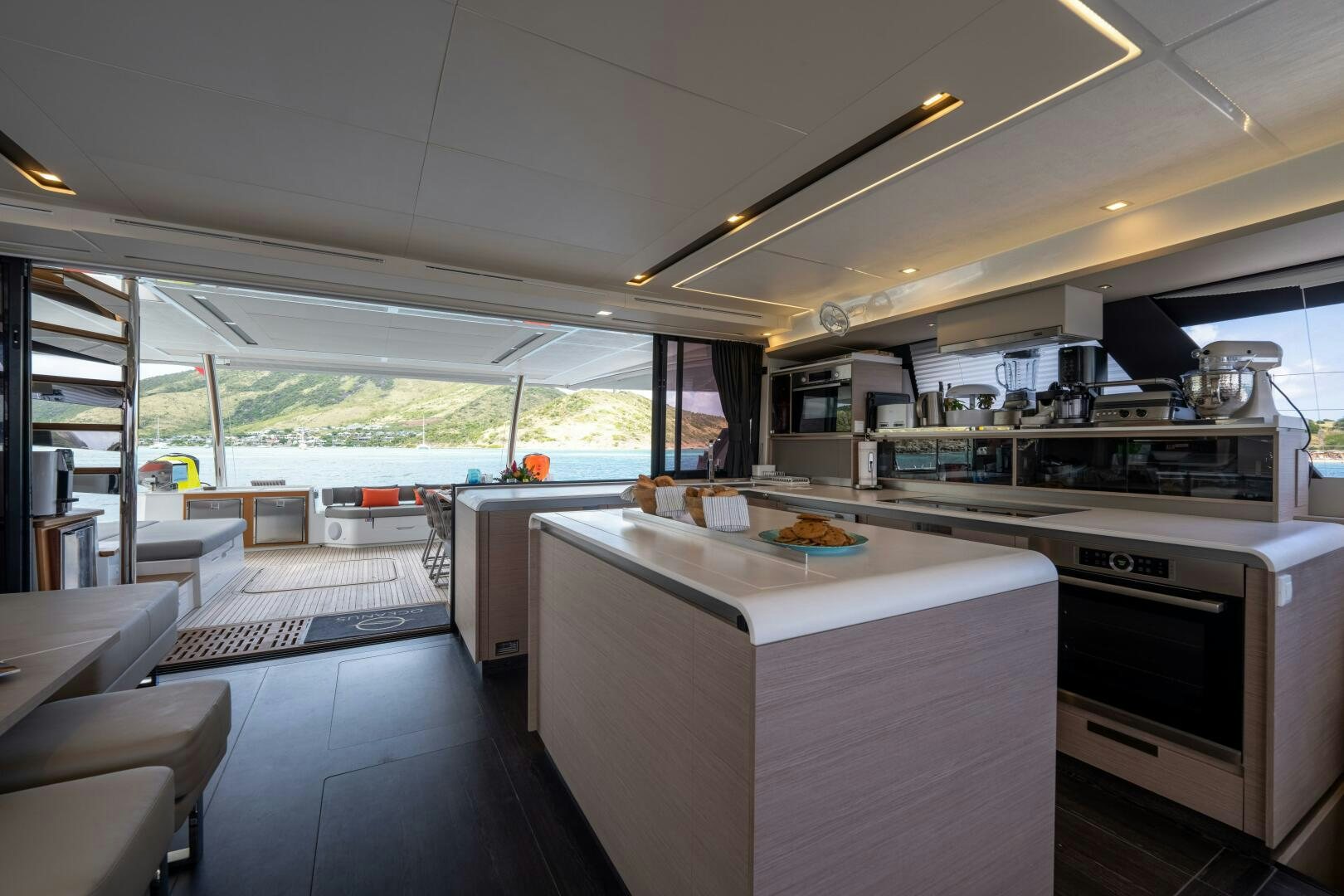 a kitchen with a large window aboard OCEANUS Yacht for Sale