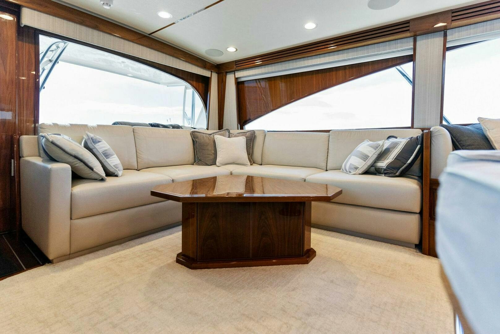 a living room with a couch and a coffee table aboard SEA HAWK Yacht for Sale