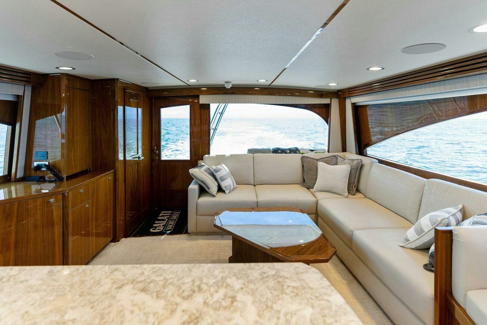 a living room with a large window aboard SEA HAWK Yacht for Sale