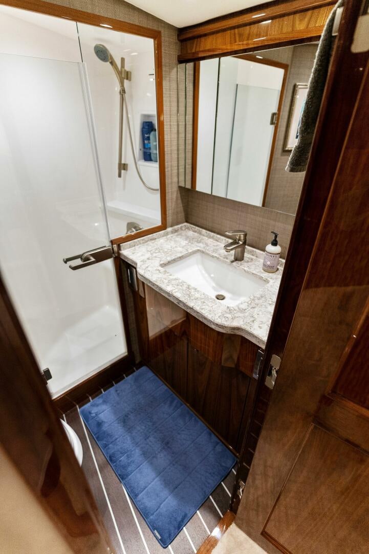 a bathroom with a sink and a mirror aboard SEA HAWK Yacht for Sale