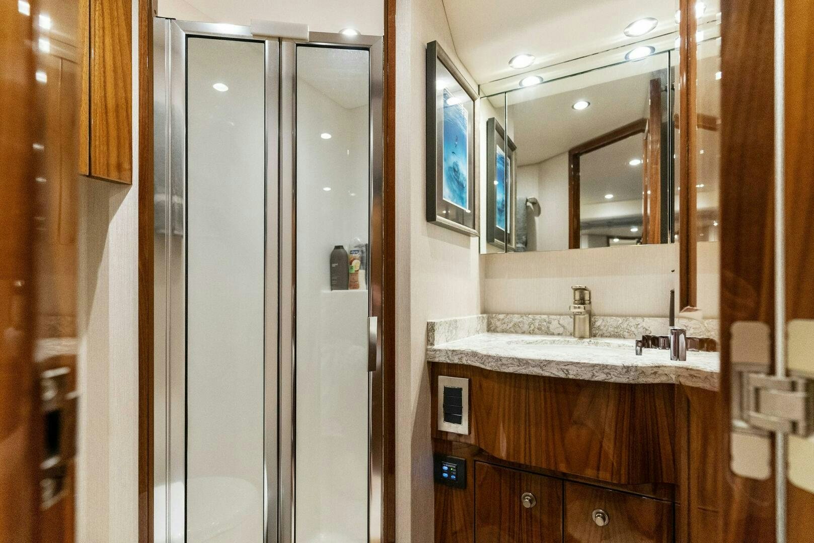 a bathroom with a large mirror aboard SEA HAWK Yacht for Sale