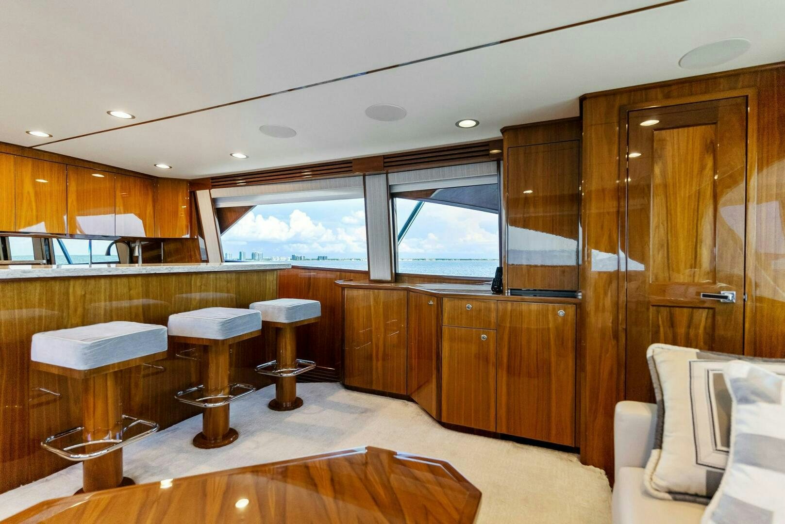 a room with wooden cabinets and a large window aboard SEA HAWK Yacht for Sale