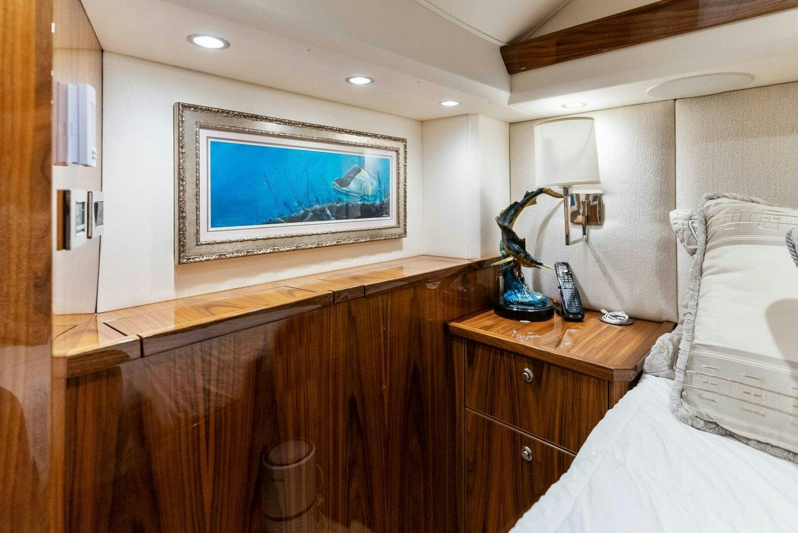 a bedroom with a large television aboard SEA HAWK Yacht for Sale