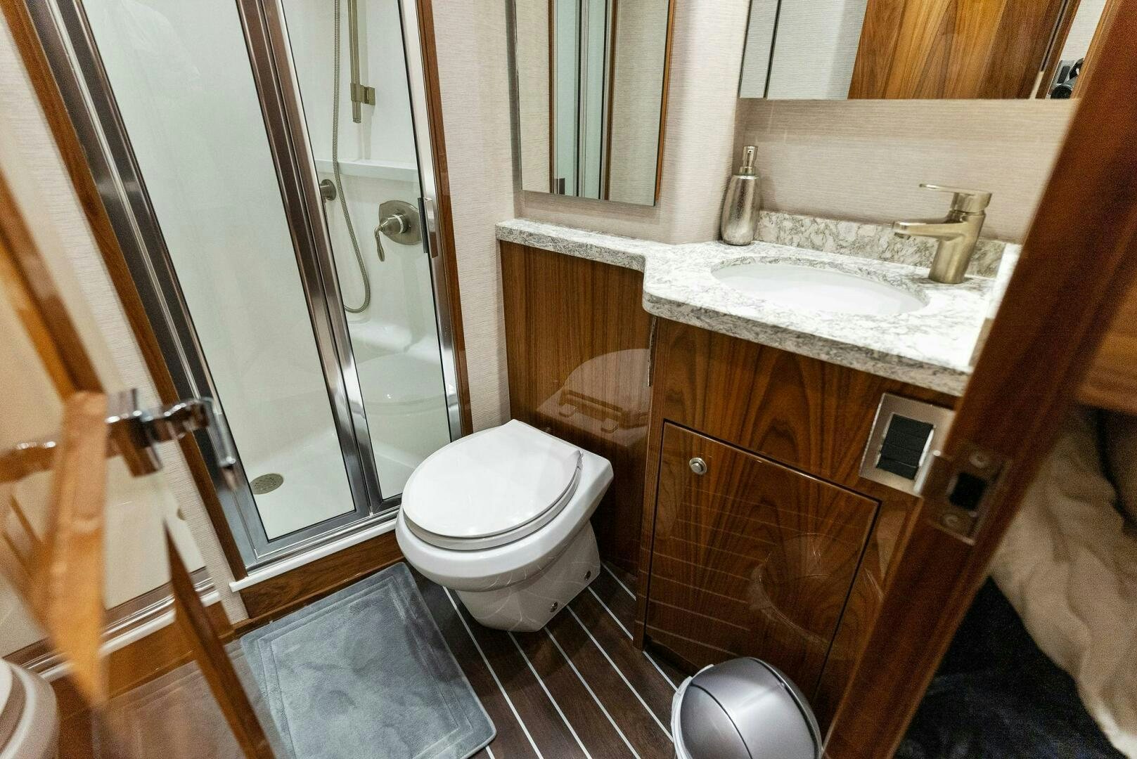 a bathroom with a sink toilet and a shower aboard SEA HAWK Yacht for Sale