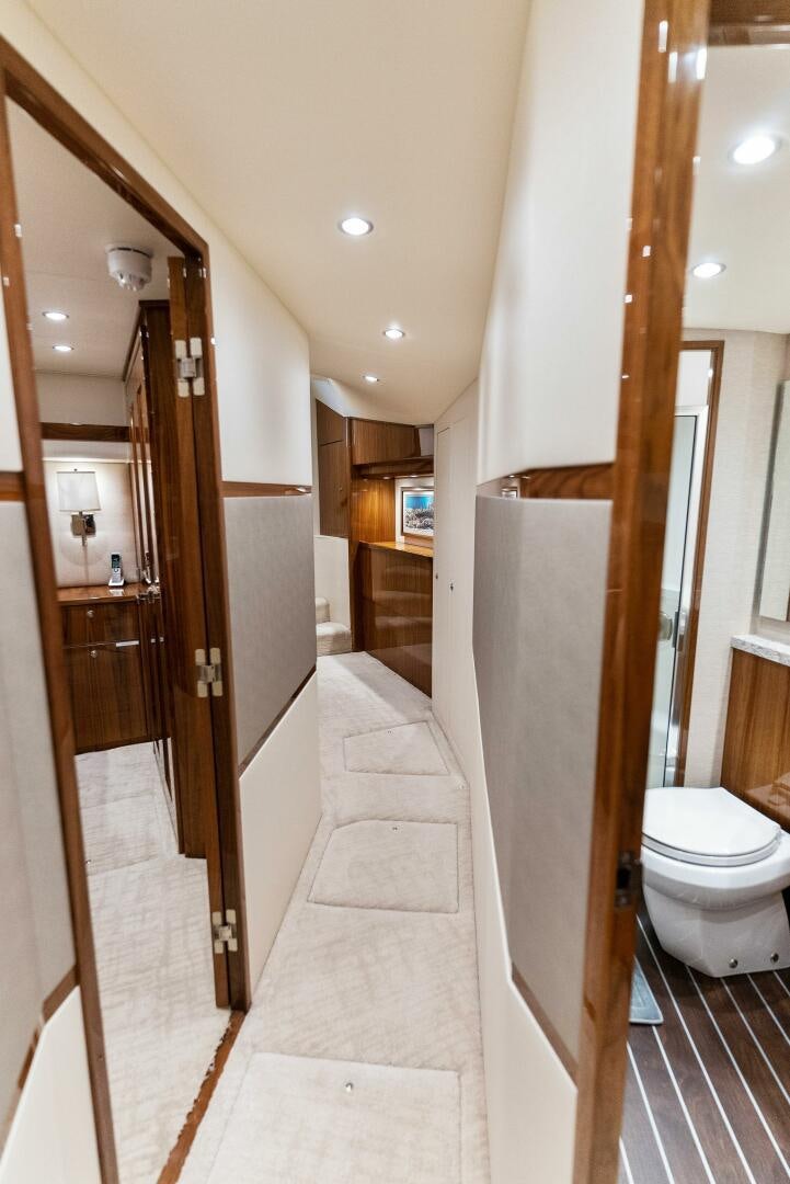 a bathroom with a toilet and a mirror aboard SEA HAWK Yacht for Sale