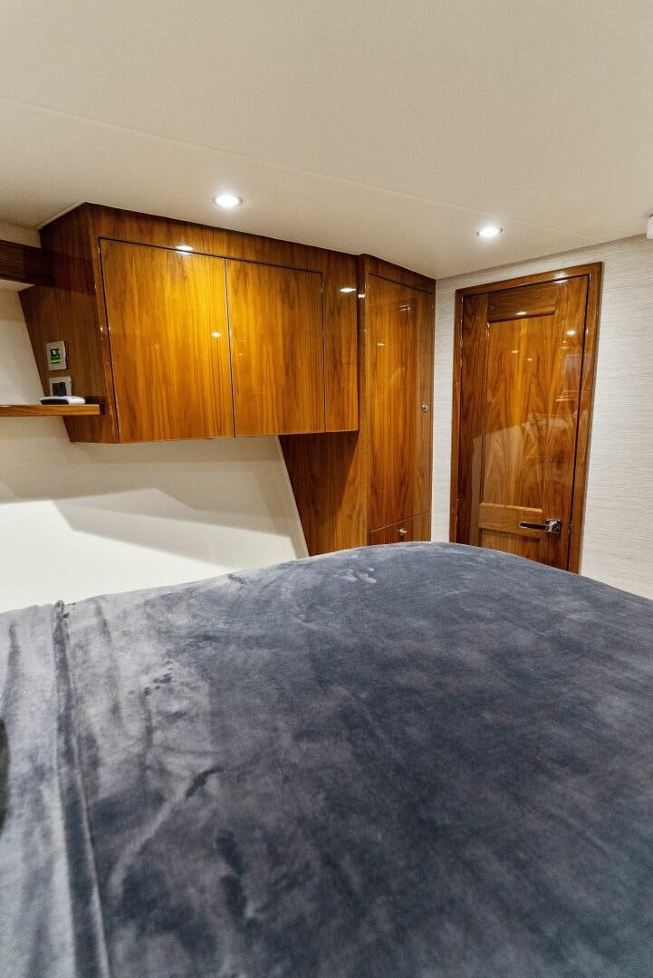 a bed with a white sheet aboard SEA HAWK Yacht for Sale