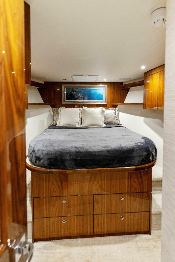 a bed with a black frame aboard SEA HAWK Yacht for Sale