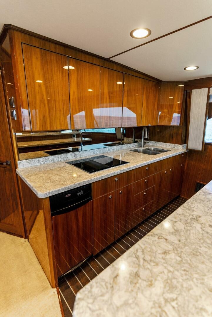 a kitchen with a marble counter top aboard SEA HAWK Yacht for Sale