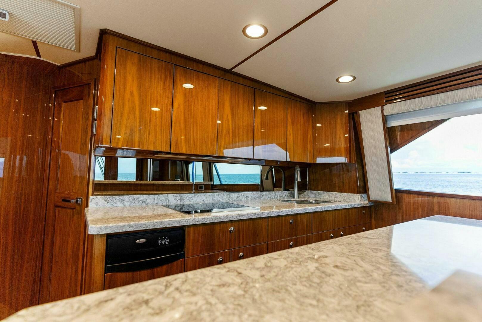a kitchen with wooden cabinets aboard SEA HAWK Yacht for Sale