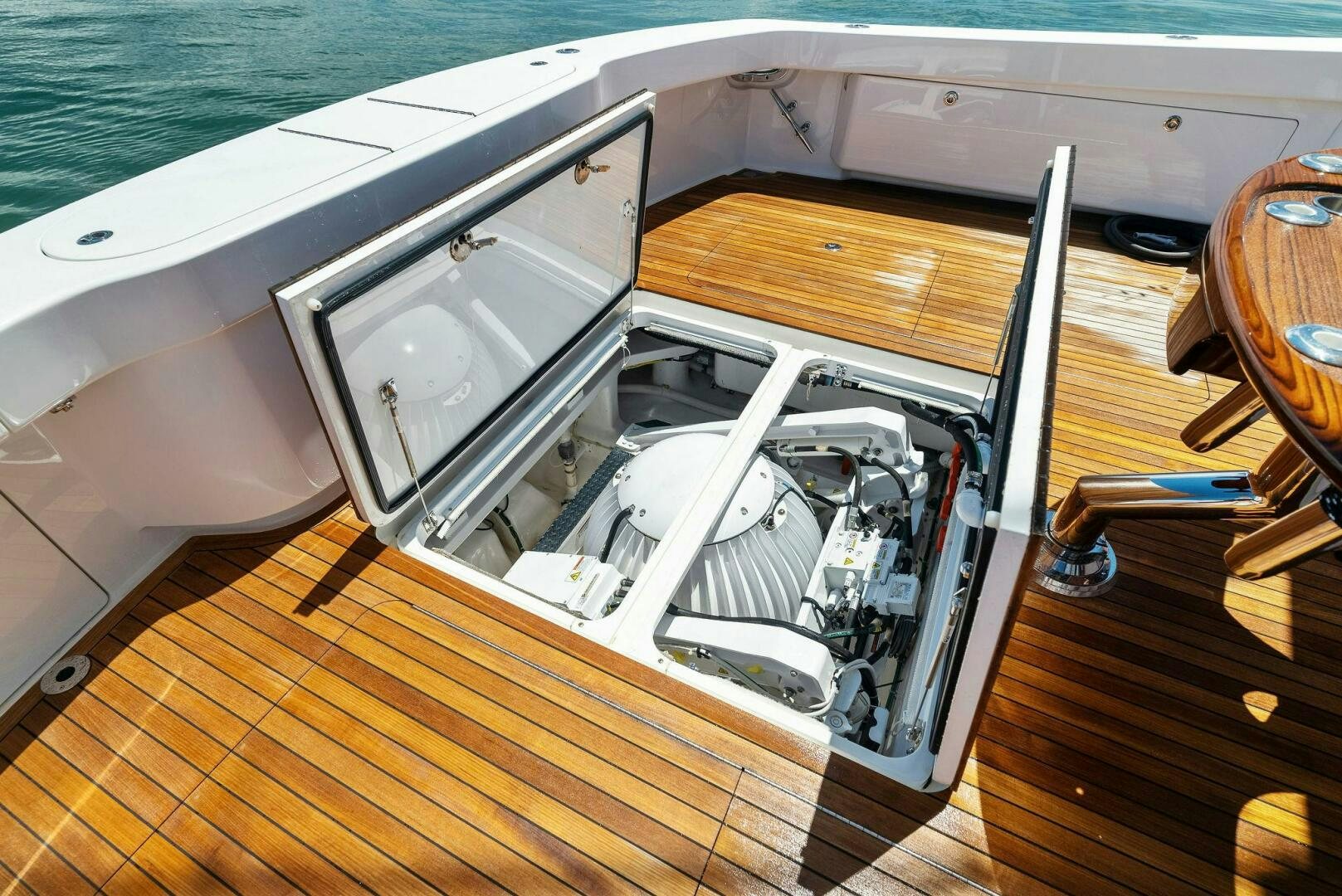 a white machine on a wooden surface aboard SEA HAWK Yacht for Sale