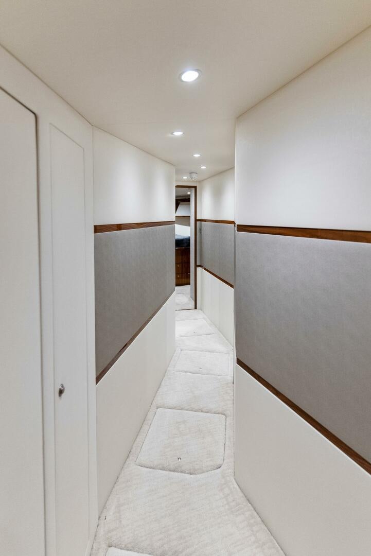 a hallway with white walls aboard SEA HAWK Yacht for Sale