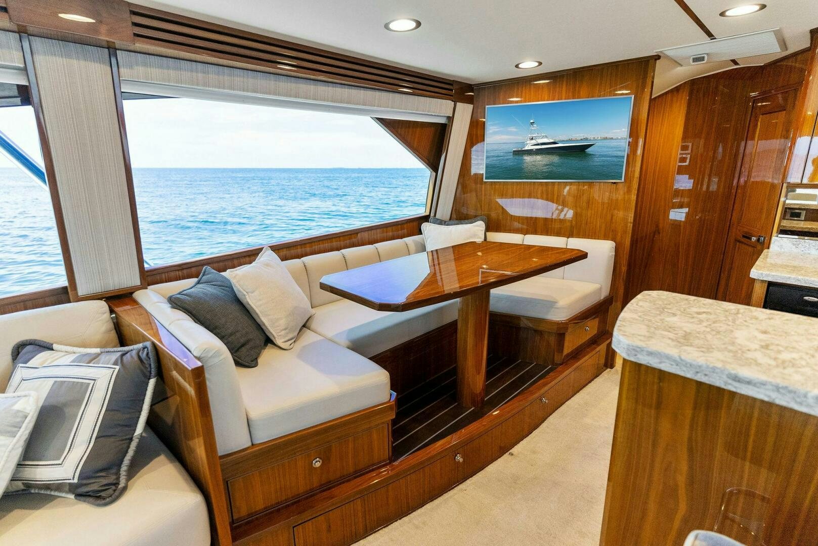 a room with a table and chairs aboard SEA HAWK Yacht for Sale